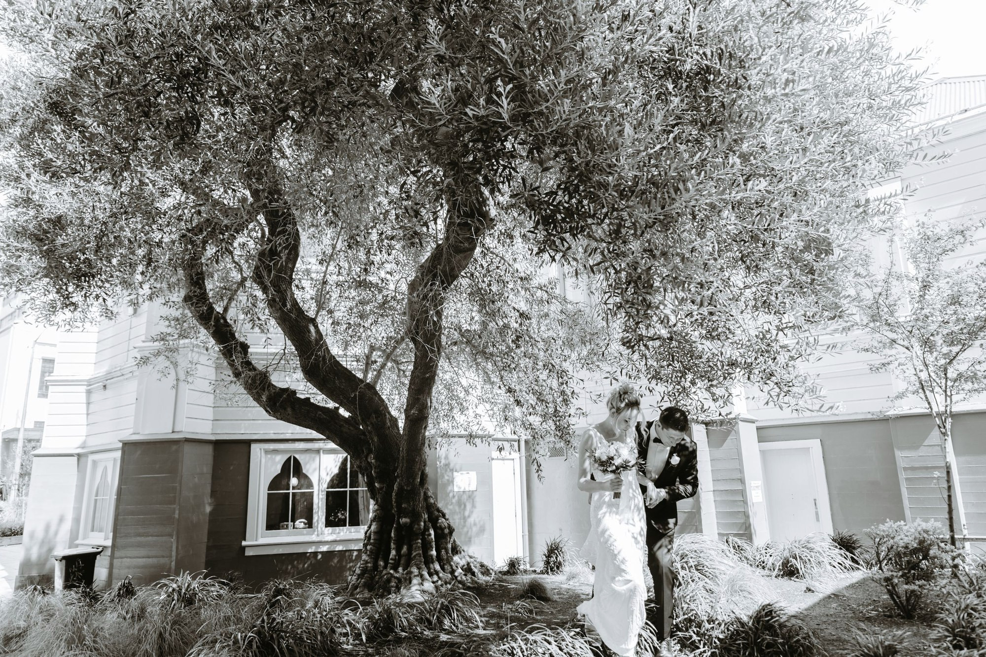 Couple walking a colonnade