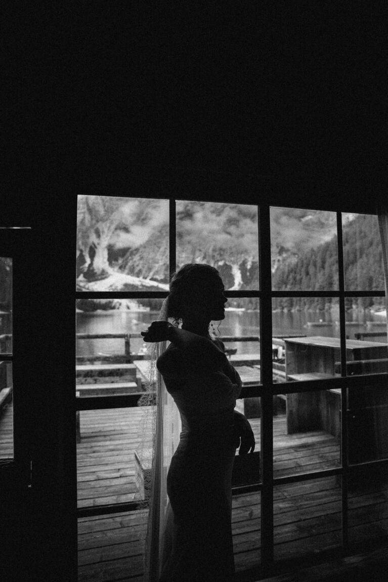 The bride by the window before the ceremony