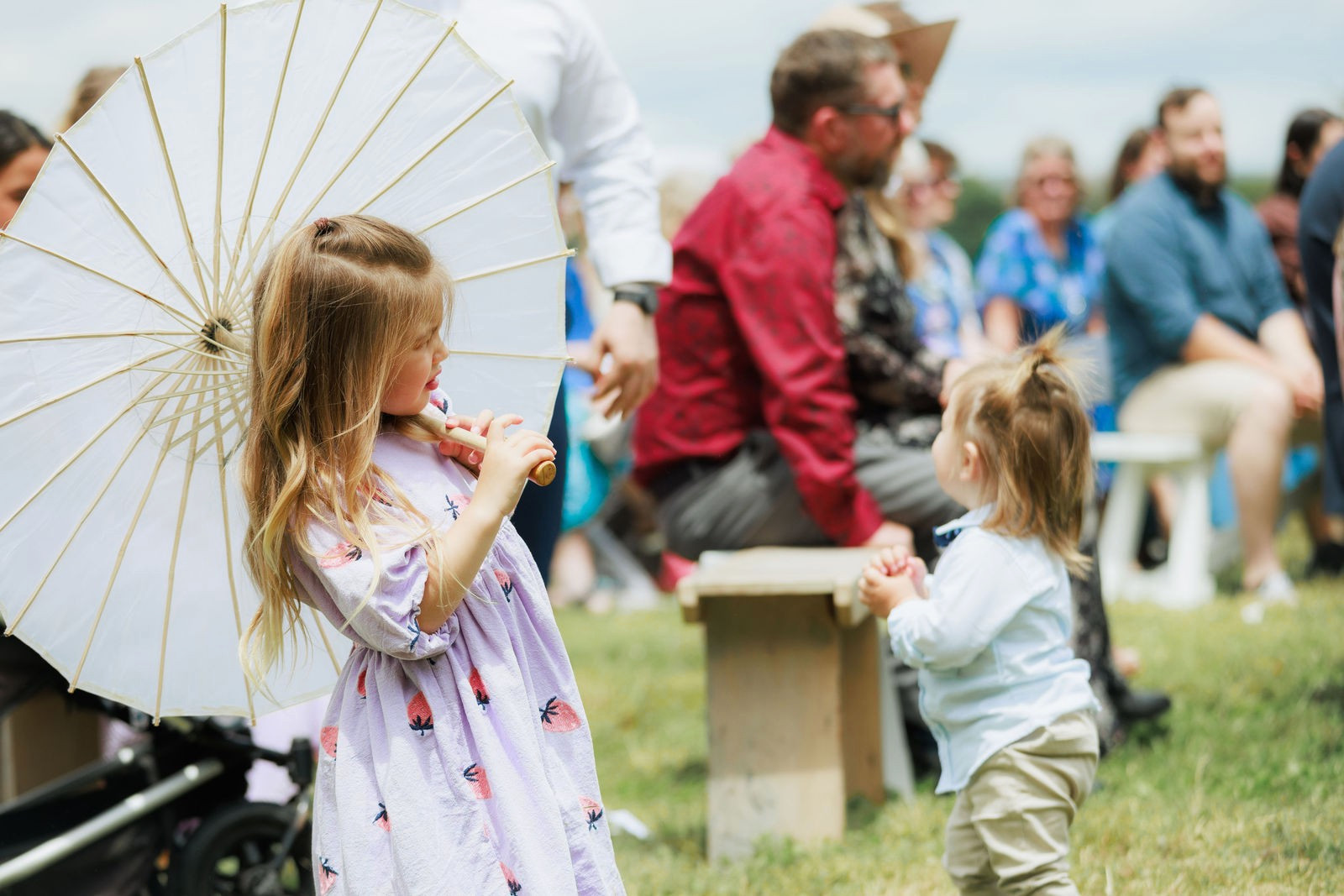 A flower girl with a parasol