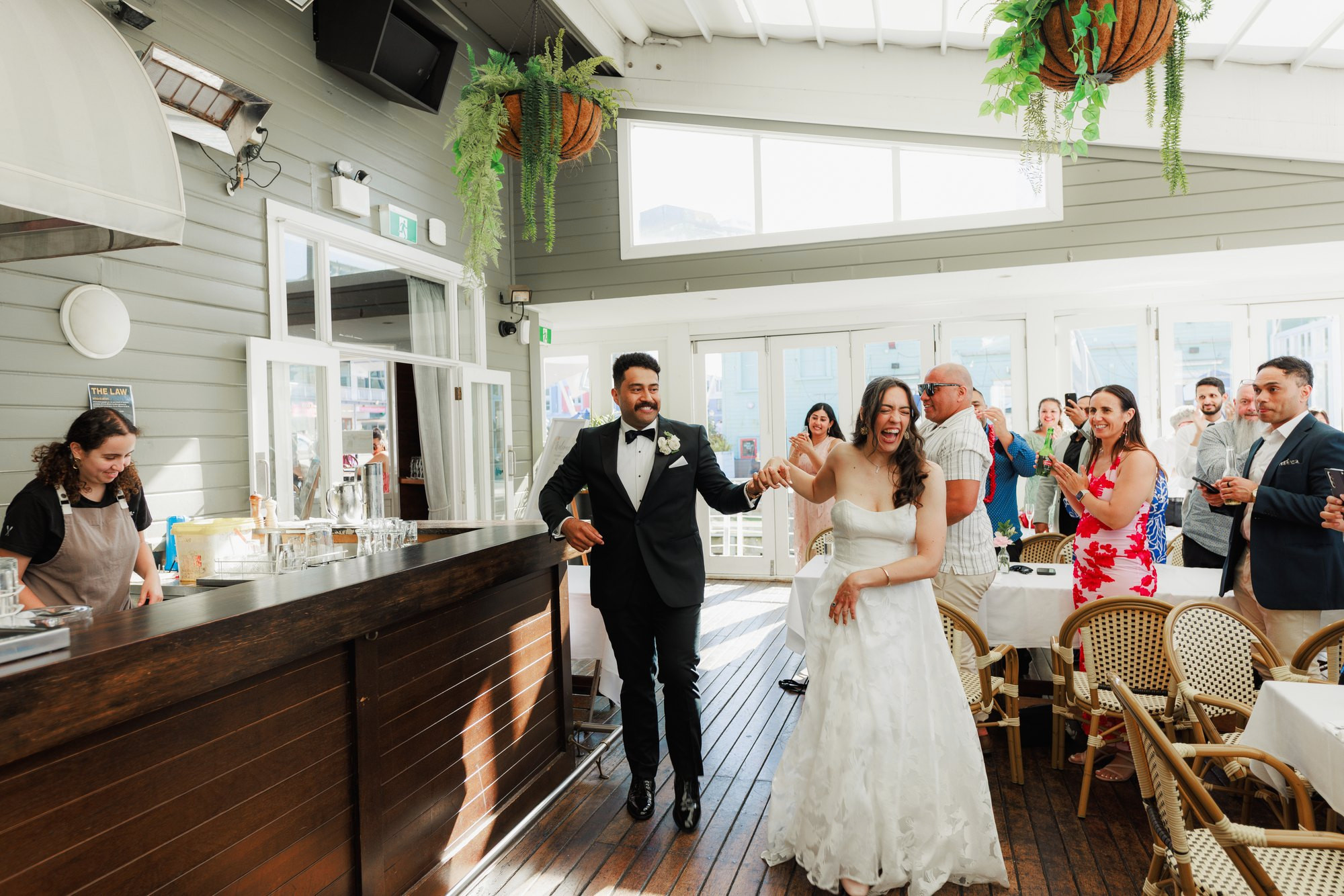 The couple greeted into the reception
